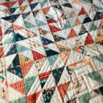 Half Square triangle quilt; art gallery southwest fabric