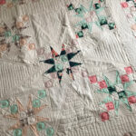 Pointed star quilt with custom quilting